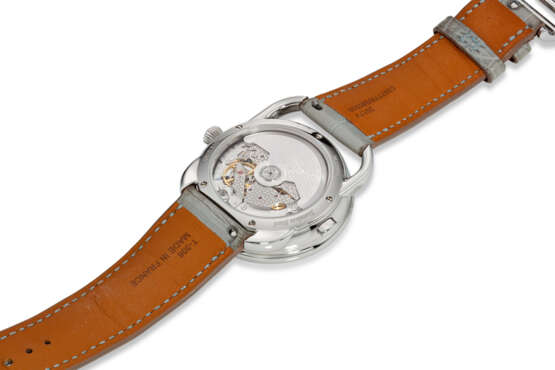 HERMÈS, REF. AR10.530, ARCEAU LE TEMPS VOYAGEUR, A FINE STEEL AND DIAMOND-SET WORLD TIME WRISTWATCH WITH ROTATING MOTHER-OF-PEARL DISPLAY - photo 3