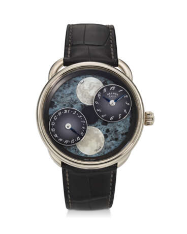 HERMÈS, REF. AR1.890F, ARCEAU L’HEURE DE LA LUNE, A FINE 18K WHITE GOLD WRISTWATCH WITH DUAL MOON PHASES, DATE, AND BLUE MOTHER-OF-PEARL DIAL - photo 1