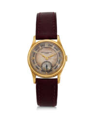 PATEK PHILIPPE, REF. 460, CALATRAVA, AN EXTREMELY RARE 18K YELLOW GOLD WRISTWATCH WITH “MIRRORED” SECTOR DIAL