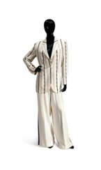 A CREAM PONGEE SILK SUIT JACKET AND TROUSERS WITH BLUE BEAD AND RHINESTONE PINSTRIPES