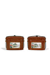 A PAIR OF CORAL-GROUND FAMILLE ROSE BOXES AND COVERS
