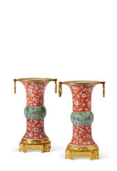 A PAIR OF ORMOLU-MOUNTED CORAL, GREEN AND AUBERGINE-DECORATED VASES