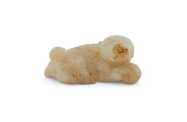 A WHITE AND RUSSET JADE 'BOY AND BUDDHIST LION' GROUP