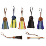 A GROUP OF SEVEN: FIVE LEATHER "PADDOCK FLOT" CHARMS, A LEATHER AND WOOD MINI WHIP CHARM AND A LEATHER WITH HAIR MINI WHIP CHARM - фото 1