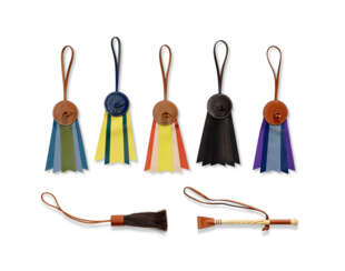 A GROUP OF SEVEN: FIVE LEATHER "PADDOCK FLOT" CHARMS, A LEATHER AND WOOD MINI WHIP CHARM AND A LEATHER WITH HAIR MINI WHIP CHARM