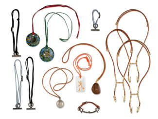 A GROUP OF THIRTEEN LEATHER BRACELETS AND LEATHER NECKLACES, SILK, LEATHER, SILVER PLATED AND METAL BRACELETS, HANGERS AND NECKLACES AND LEATHER, CRYSTAL, PORCELAIN AND COROZO NECKLACES