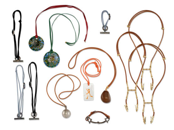 A GROUP OF THIRTEEN LEATHER BRACELETS AND LEATHER NECKLACES, SILK, LEATHER, SILVER PLATED AND METAL BRACELETS, HANGERS AND NECKLACES AND LEATHER, CRYSTAL, PORCELAIN AND COROZO NECKLACES - фото 1