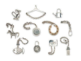 A GROUP OF ELEVEN VARIOUS BAG CHARMS AND CADENAS