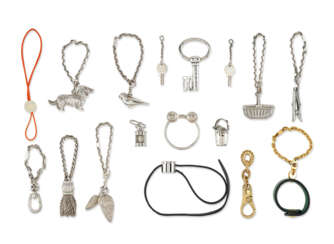 A GROUP OF SEVENTEEN BAG CHARMS AND KEY RINGS