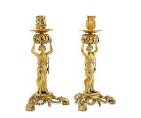 THE ARUNDELL OF WARDOUR &#39;FLORA&#39; CANDLESTICKS
A PAIR OF GEORGE III SILVER-GILT CANDLESTICKS