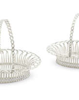 A PAIR OF GEORGE III SILVER CAKE BASKETS