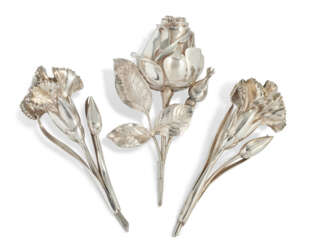 A SUITE OF THREE VICTORIAN SILVER FLORAL NOVELTY VINAIGRETTES