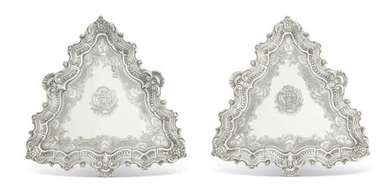 A PAIR OF GEORGE II SILVER SALVERS OR KETTLE STANDS - фото 1