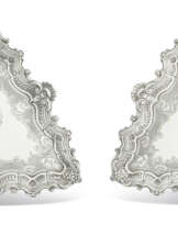 A PAIR OF GEORGE II SILVER SALVERS OR KETTLE STANDS