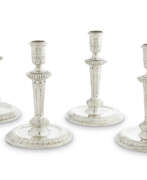 David Willaume I. A SET OF FOUR WILLIAM III SILVER CANDLESTICKS