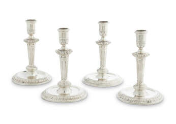 A SET OF FOUR WILLIAM III SILVER CANDLESTICKS