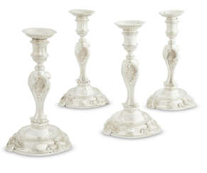A SET OF FOUR GEORGE II SILVER CANDLESTICKS