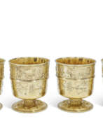 Period of George IV. A SET OF FOUR GEORGE IV SILVER-GILT BEAKERS