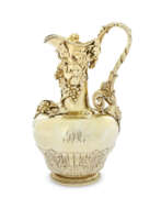 Period of George IV. A GEORGE IV SILVER-GILT CLARET JUG AND COVER