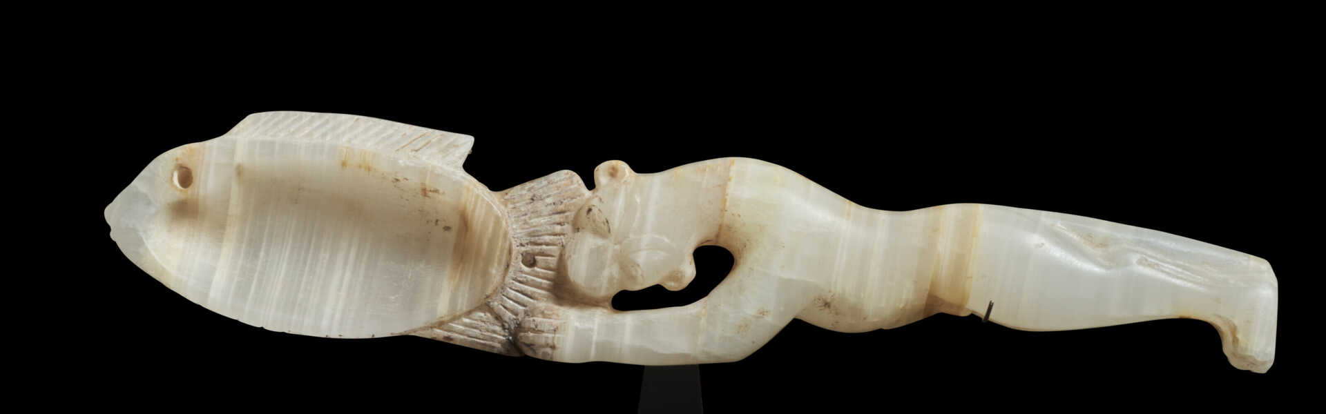 AN EGYPTIAN ALABASTER COSMETIC SPOON