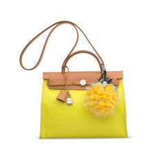 A SET OF TWO: A LIME CANVAS & SABLE VACHE HUNTER LEATHER HERBAG 31 WITH PALLADIUM HARDWARE & A FENDI PINEAPPLE BAG CHARM