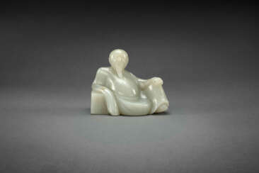 A VERY RARE PALE GREENISH-WHITE JADE FIGURE OF A SEATED SCHOLAR