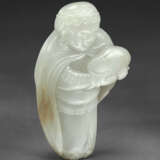 A RARE PALE GREENISH-WHITE AND RUSSET JADE FIGURE OF A TRIBUTE BEARER PRESENTING A JADE BOULDER - photo 3