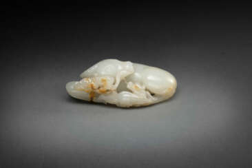 A SUPERB WHITE AND RUSSET JADE &#39;OX AND QILIN&#39; GROUP