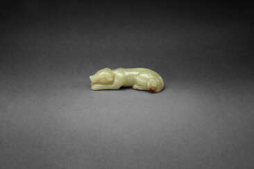 AN EXCEPTIONAL YELLOW JADE FIGURE OF A RECUMBENT HOUND