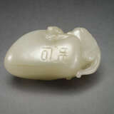 AN UNUSUAL INSCRIBED PALE YELLOWISH-GREEN JADE CARVING OF A RAM EMERGING FROM A PEBBLE - photo 3