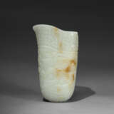 A SUPERB AND FINELY CARVED ARCHAISTIC WHITE JADE RHYTON - photo 1