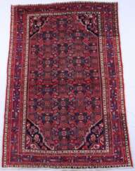 Orientteppich - Wolle, rotgrundig, ornamental gemustert, mehrfa