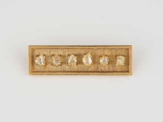 DIAMANT-BROSCHE Gelbgold. 5,0 x 1,5 cm, Ges.-Gew. ca. 16,4