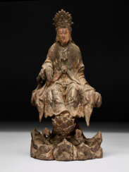 A CARVED WOOD FIGURE OF A SEATED BODHISATTVA