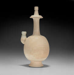 A RARE WHITE-GLAZED KUNDIKA