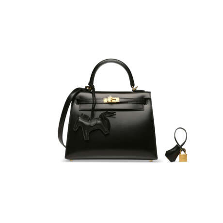 A SET OF TWO: A BLACK CALF BOX LEATHER SELLIER KELLY 25 WITH GOLD HARDWARE & A ROD&#201;O CHARM PM - photo 1