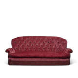 A CRIMSON VELVET UPHOLSTERED THREE-SEATER SOFA - photo 1