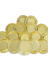 A COMPOSITE SET OF EIGHTEEN GEORGE III SILVER-GILT DINNER PLATES