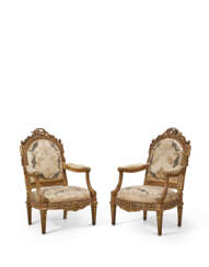 A PAIR OF LATE LOUIS XV GILT WALNUT AND WHITE-PAINTED FAUTEUILS