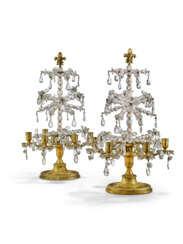 A PAIR OF FRENCH ROCK CRYSTAL, CUT-GLASS, AND ORMOLU SIX-LIGHT CANDELABRA
