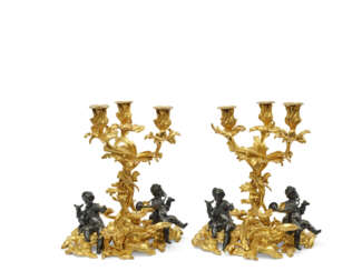 A PAIR OF LOUIS XV PATINATED-BRONZE AND ORMOLU THREE-LIGHT CANDELABRA