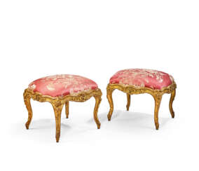 A MATCHED PAIR OF FRENCH GILT WALNUT TABOURETS