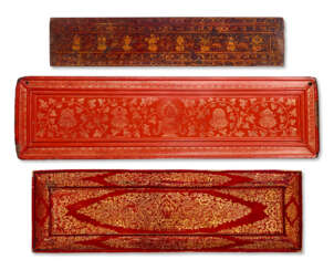 A GROUP OF THREE GILT AND LACQUERED WOODEN BOOK COVERS