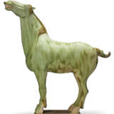 A SMALL GREEN-GLAZED POTTERY FIGURE OF A HORSE - photo 1