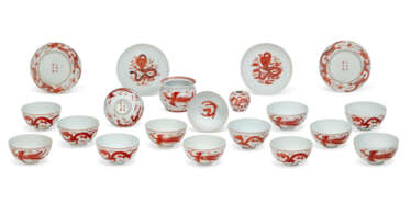 A GROUP OF TWENTY IRON-RED-DECORATED DRAGON BOWLS AND DISHES
