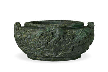 A VERY LARGE SPINACH GREEN JADE 'DRAGON' BASIN
