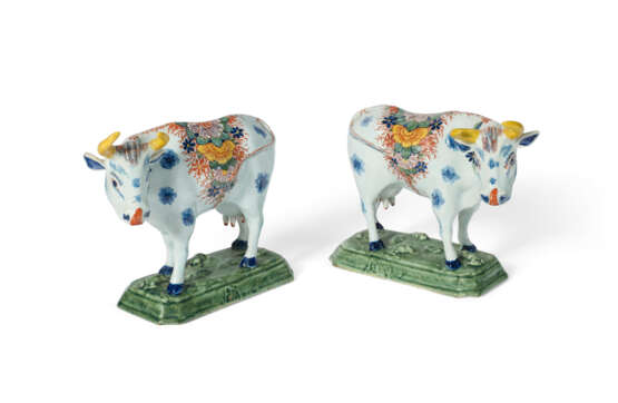 A PAIR OF DUTCH DELFT POLYCHROME MODELS OF STANDING COWS - photo 1