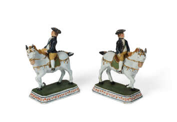 A PAIR OF DUTCH DELFT COLD-PAINTED EQUESTRIAN GROUPS