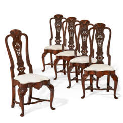 A SET OF FIVE WALNUT DINING CHAIRS