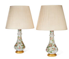 A PAIR OF FRENCH OPAQUE WHITE GLASS VASES MOUNTED AS LAMPS